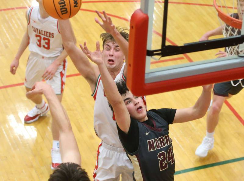L-P's Jameson Hill blocks Morris's Auston Delahera's shot under the hoop on Monday, Feb. 9, 2026 in Sellett Gymnasium at L-P High School.