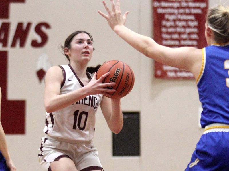 Marengo’s Bella Frohling takes an outside shot against Johnsburg in varsity girls basketball at Marengo Tuesday night.