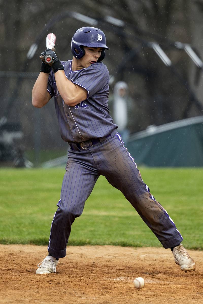 Dixon’s Gage Helfrich gets hit by a pitch against Rock Falls Thursday, April 9, 2026.