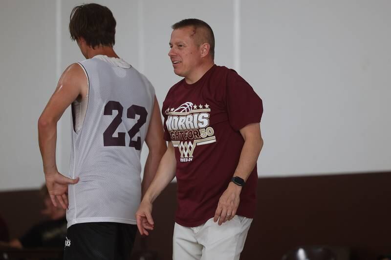 Morris head coach Joe Blumberg talks to a player during the game against Plainfield South at the 37th Morris Boys Shootout on Tuesday, June 25, 2024.