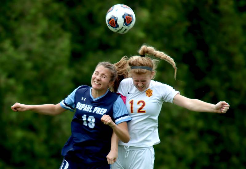 Richmond-Burton’s Madison Havlicek, right, battles DePaul Prep’s Ava Buccholz during sectional title game action at Marian Central in Woodstock Friday evening.