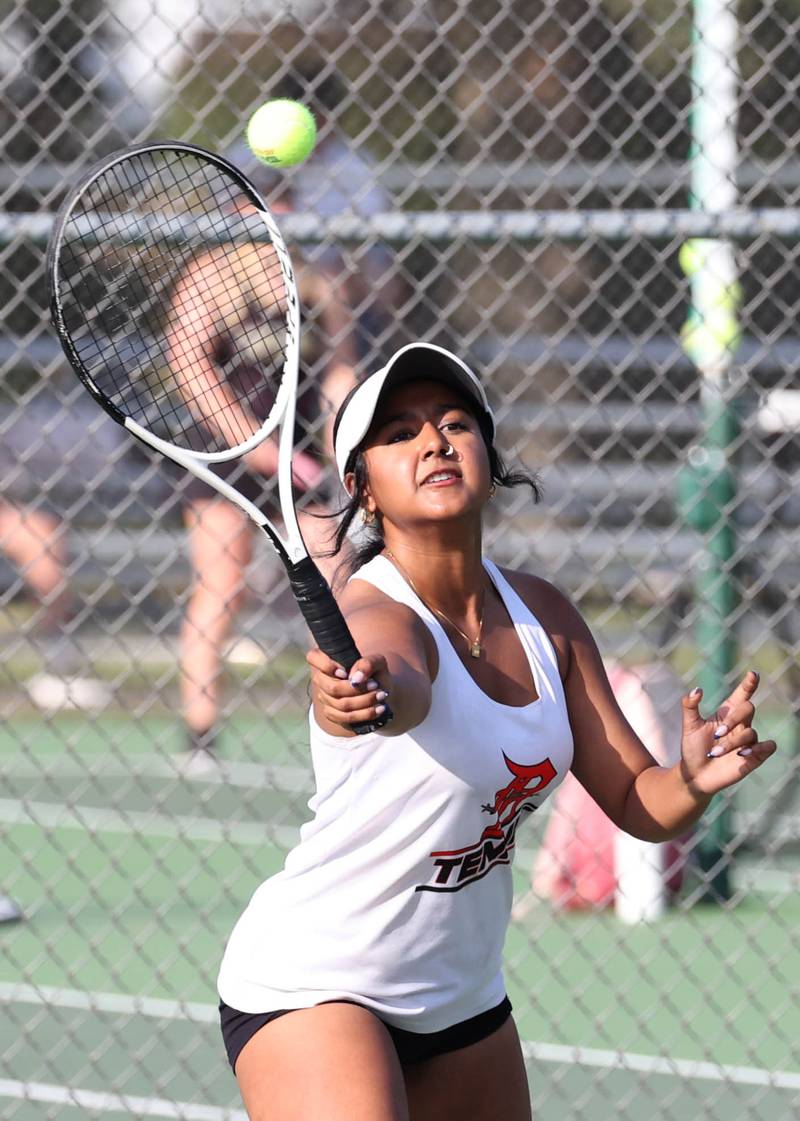 DeKalb’s Preeti Islam hits a shot during her doubles match against Sycamore Wednesday, Sept. 18, 2024, at Sycamore High School.