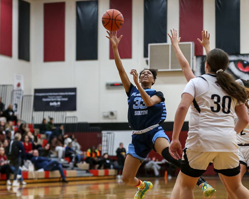 Plainfield South's Jazlynn Foster (33) puts up a shot during basketball game between Plainfield South at Plainfield North. Jan 4, 2024.