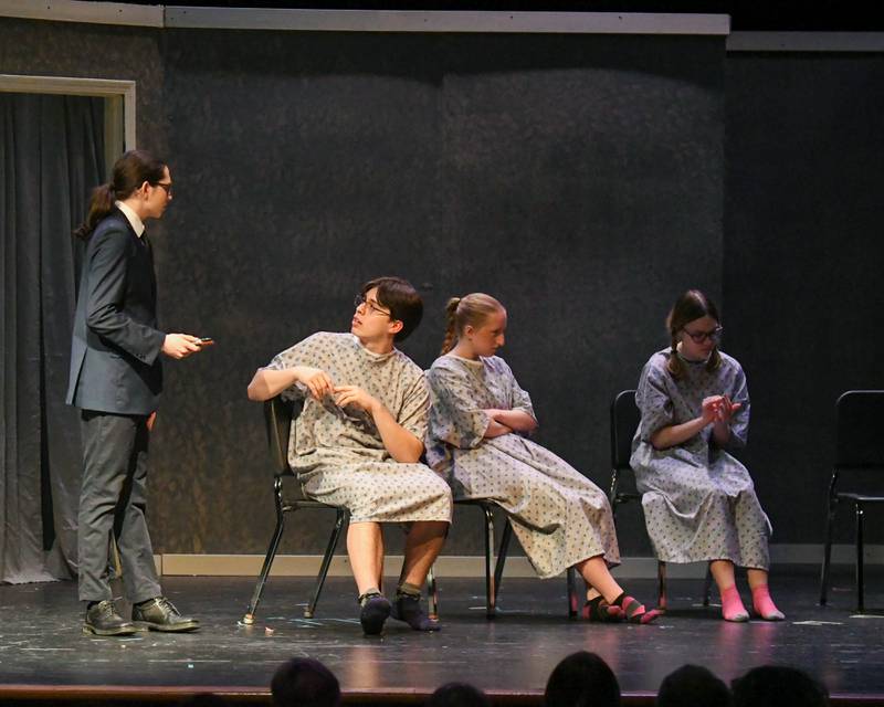 Daniel Nunez plays the character named death, left, talks with Ron played by Dylan Andrae during a therapy meeting in a one act play called Cheating Death held on Saturday March 22, 2025, held at Lyons Township High School south campus.