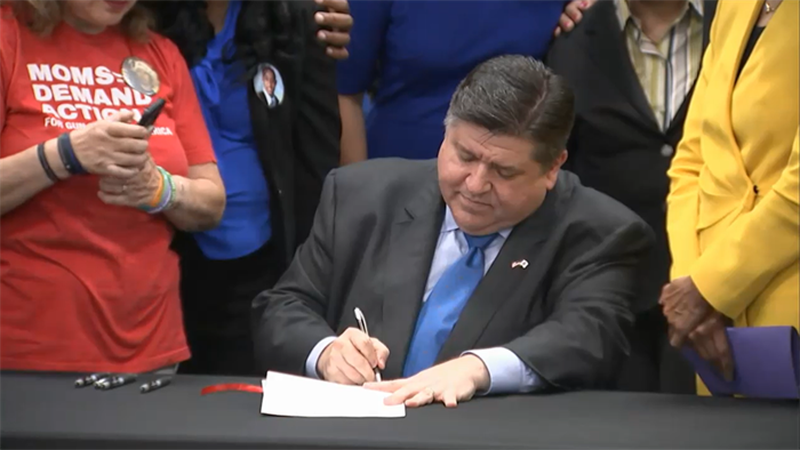 Gov. JB Pritzker signs House Bill 4383 Wednesday, May 18, 2021, at an event in Chicago, regulating the possession and sale of "ghost guns." (Credit: Blueroomstream.com)