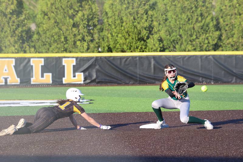 Herscher's Mikaela Vadeboncouer dives back to second base just ahead of the throw to Coal City's Leah Jensen during Coal City's 14-10 victory over Herscher on Monday, April 20, 2026.
