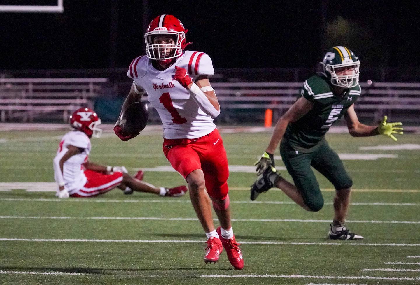 Yorkville's Dom Coronado (1) runs after the catch for a touchdown against Plainfield Central during a football game at Plainfield Central High School on Friday, Sept. 15, 2023.