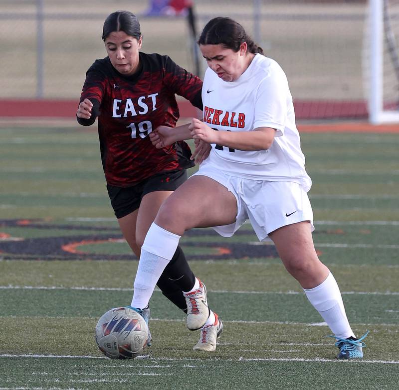 DeKalb's Alexia Ortiz kicks the ball away from Rockford East's Ava Gallagher during their game Tuesday, March 25, 2025, in the Barb Fest tournament at DeKalb High School.