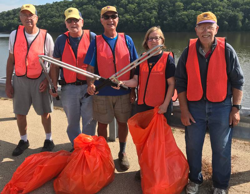 (Left to right); Oregon Lions Club members Jerry Hinrichs, Ed Smola, Grant Afflerbaugh, Lori Peterson, and Ray Farrey cleaning up garbage off of Illinois Route 2 Tuesday, Aug. 16, north of Oregon. Not pictured is fellow Lions Club member Jim Hoff.