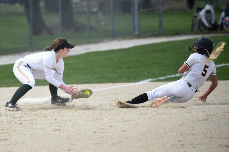 Bishop McNamara's Camille Czako, left, waits to apply a tag on St. Laurence's Demi Lotus at third base during a game at Bishop McNamara Saturday, April 11, 2026.