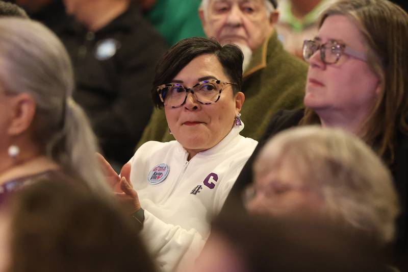 Joliet Junior College Trustee Alicia Morales applauds a speaker against the proposed data center at the City of Joliet City Council meeting on Monday, March 16, 2026 in Joliet.