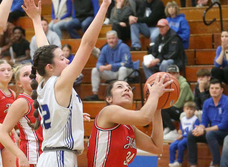 Hall's Natalia Zamora eyes the hoop as Princeton's Avaya Koning defends during the Princeton Holiday Girls Basketball Tournament on Friday, Nov. 23, 2024 at Princeton High School.