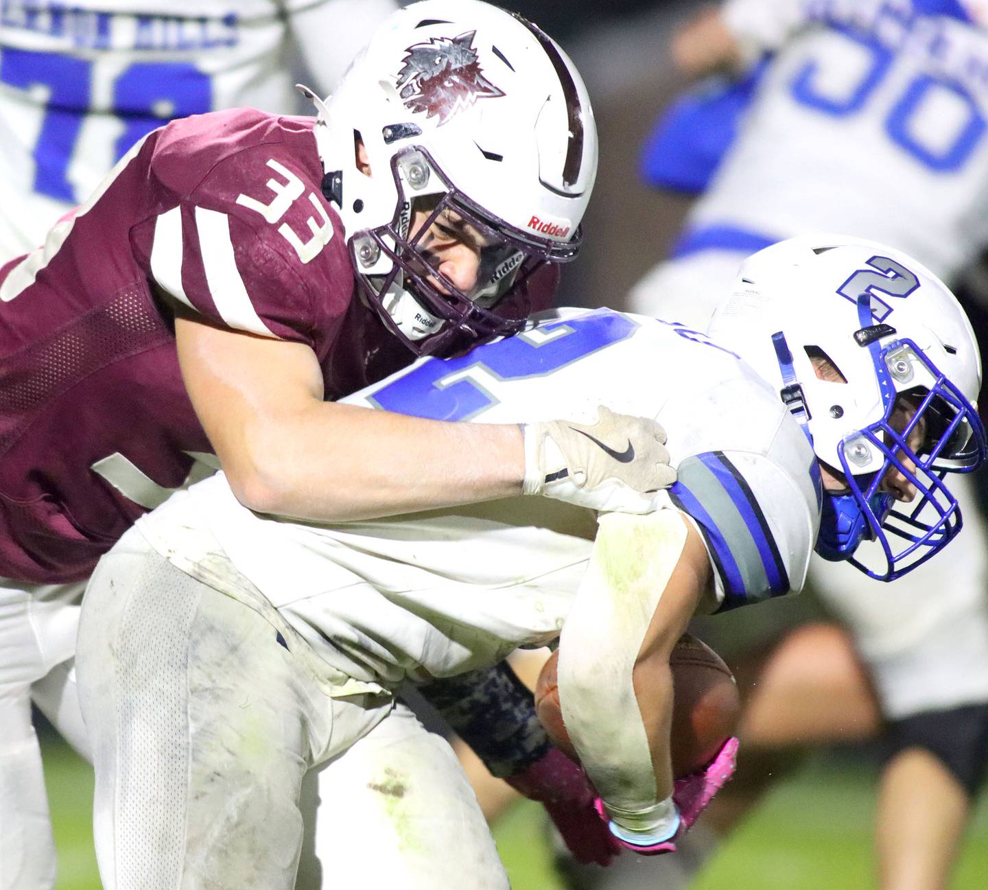 Prairie Ridge’s Ethan Hart wraps up Vernon Hills’ Giuseppe Urso in IHSA football Class 5A first-round playoff action at Prairie Ridge High School in Crystal Lake on Friday, October 31, 2025.