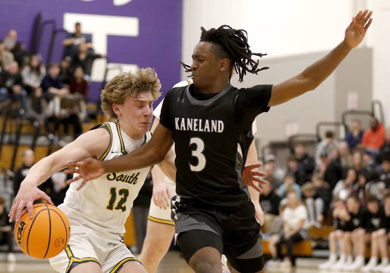 Crystal Lake South's Vincent Santarelli tries to drive against Kaneland's Marshawn Cocroft during the IHSA Class 3A Rochelle Sectional championship basketball game on Friday, March 7, 2025, at Rochelle High School.