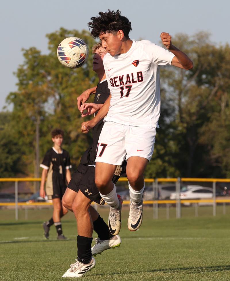 DeKalb’s Julian Hernandez heads the ball away from a Sycamore player during their game Tuesday, Oct. 3, 2023, at Sycamore High School.
