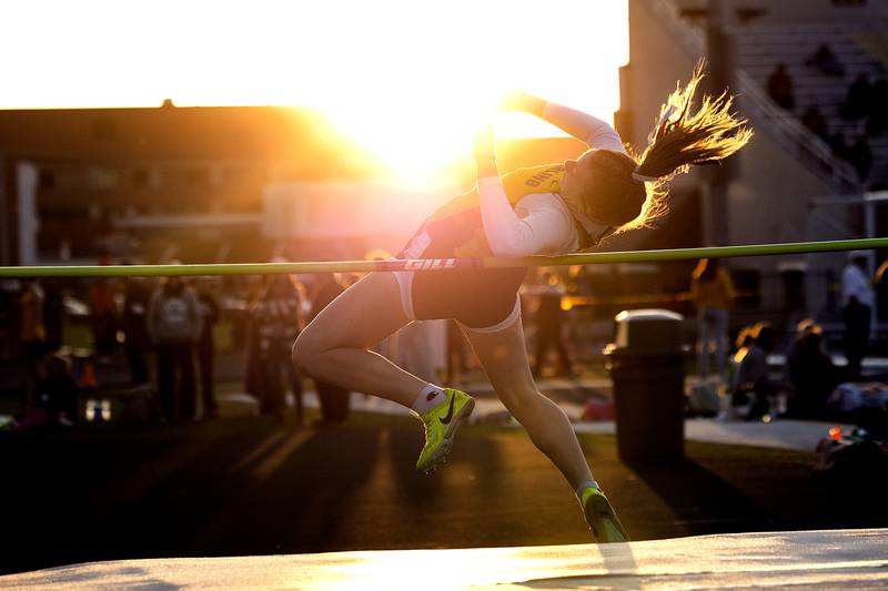 Sterling’s Abby Ryan makes her final jump in the high jump Thursday, April 25, 2024 at the Sterling High School Night Relays.