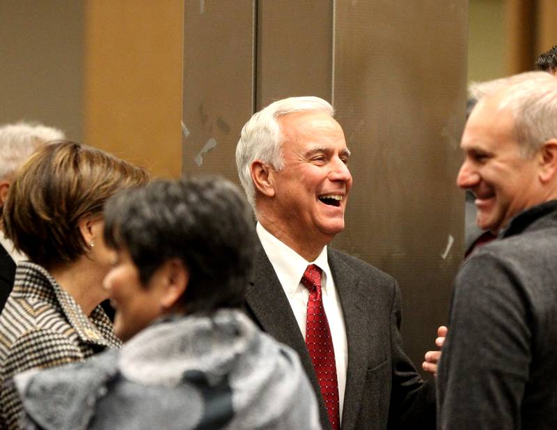 Kane County Board Member Bill Lenert shares a laugh before a swearing in ceremony for newly and re-elected board members at the Kane County Circuit Court in St. Charles on Monday, Dec. 5, 2022.