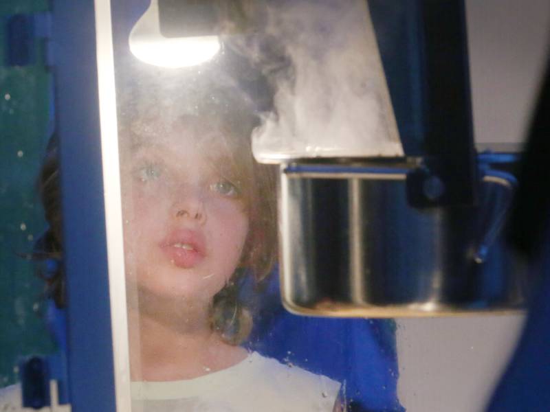 Roman Talbart 7, of Peru, looks through a popcorn maker while waiting for his bag of popcorn during the “Movie in the Park” night on Friday, Aug. 15, 2025 at Centennial Park in Peru. The movie “Super Mario Bro’s was shown. The event was sponsored by Jessica Strauch State Farm, La Salle-Peru Township High School Foundation, Self Storage and P&D Sign Company!