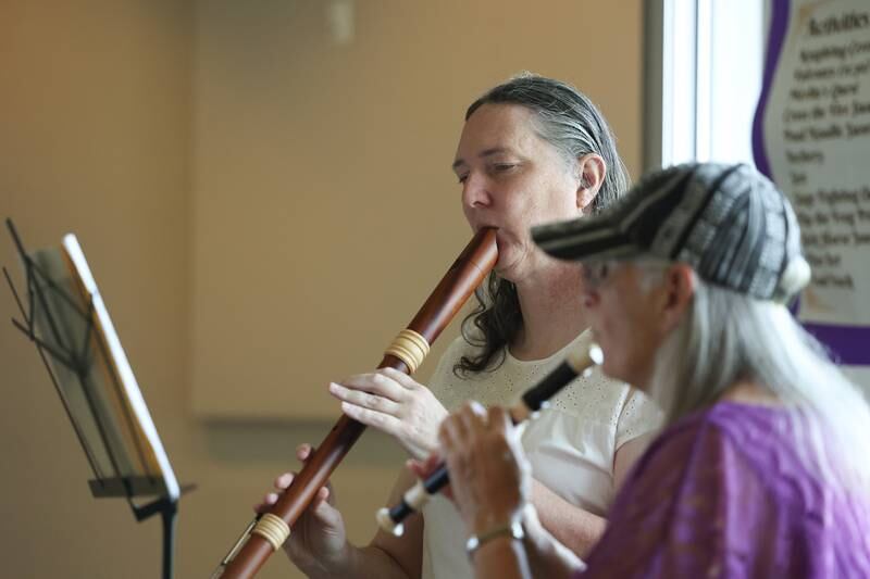 Angela Salvaggione, left, and Rose Dombrow player Renaissance music on recorders, woodwind instruments popular in the 1600 and 1700, at the Royal Faire hosted by the Joliet Public Library Black Road Branch on Saturday, July 22nd, 2023.