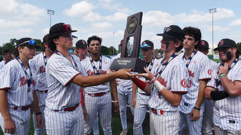Benet Academy’s Jonathon Rossi, left, and Jimmy Jasinski hold the state runner-up trophy after the Redwings’ 8-5 loss to St. Laurence during the Class 3A state baseball title game at Slammers Stadium on Saturday, June 14, 2025 in Joliet.