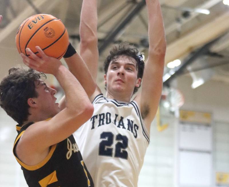 Jacobs’ Ben Jurzak, left, shoots as Cary-Grove’s Adam Bauer defends during Hinkle Holiday Classic varsity boys basketball tournament action on Thursday, Dec. 26, 2024 at Jacobs High School in Algonquin.