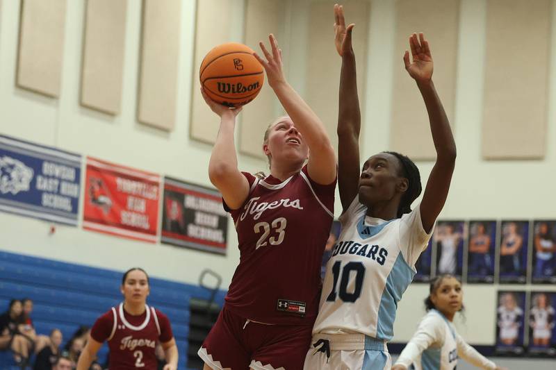 Plainfield North’s Isabella Gruber puts up the contested shot against Plainfield South on Thursday, Jan 9, 2025.