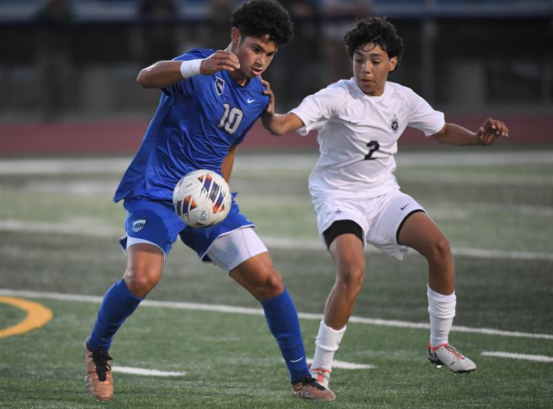 St. Charles North’s Walter De LaPaz controls the ball against West Chicago’s Hugo Cadena in a boys soccer game in St. Charles on Wednesday, August 30, 2023.