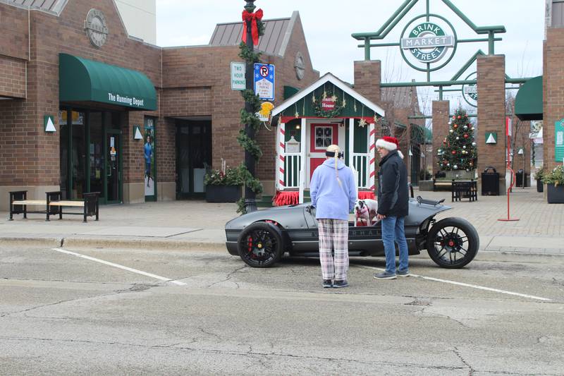 People enjoying the warm weather downtown Crystal Lake on Christmas day.