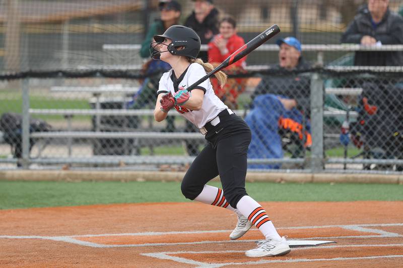 Lincoln-Way West’s Reegan Connolly watches her opposite field two run shot clear the fence against Lockport in the WJOL Softball Tournament championship game on Thursday, April 2, 2026 in Joliet.