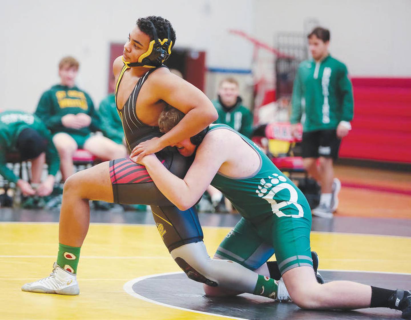 Putnam County-Hall's John Davis tries to escape from the grasp of St. Bede's Ryan Migliorini in their match at 195 pounds Saturday's Super Dual at Hall. Davis won by fall.