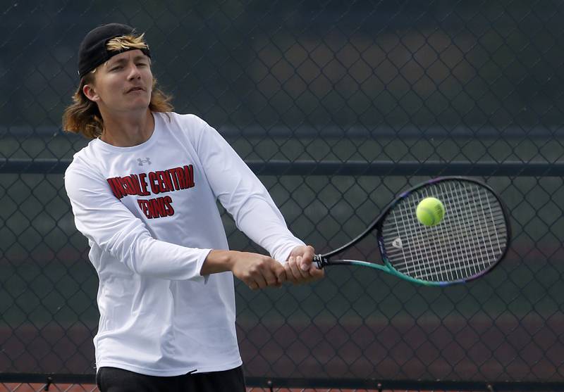 Hinsdale Central's James Theriault returns the ball during an IHSA 2A boys doubles tennis match Thursday, May 25, 2023, at Buffalo Grove High School.