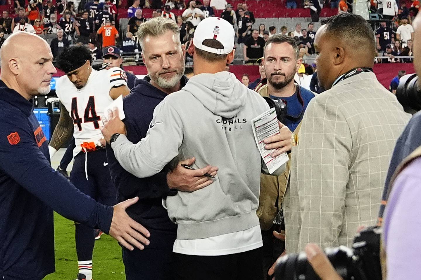 Chicago Bears head coach Matt Eberflus, left, embraces Arizona Cardinals head coach Jonathan Gannon after an NFL football game, Sunday, Nov. 3, 2024, in Glendale, Ariz. (AP Photo/Ross D. Franklin)
