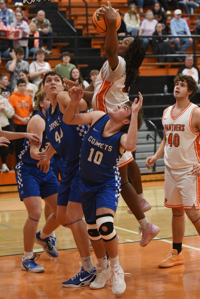 Gardner-South Wilmington's Leondre Kemp, top, grabs a rebound over Clifton Central's Blake Chandler during the River Valley Conference Tournament semifinals at Gardner-South Wilmington Tuesday, Feb. 10, 2026.