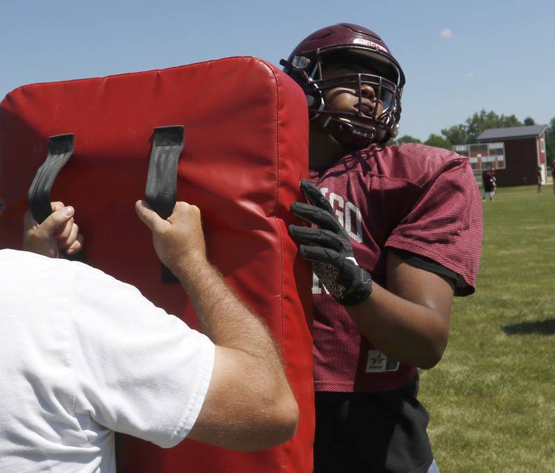 Marengo’s Evan Manites practices his blocking during summer football practice Monday, June 27, 2022, at Marengo Community High School in Marengo.