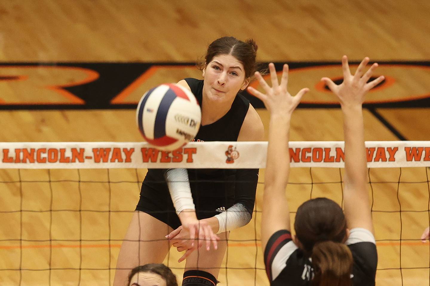 Lincoln-Way West’s Caroline Smith powers a shot against Plainfield North in the Class 4A Lincoln-Way West Regional semifinal on Tuesday, Oct. 29, 2024 in New Lenox.