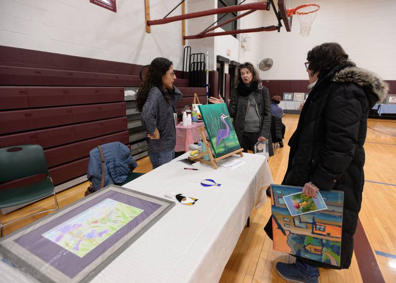 Westmont artist Linda Christensen (left) talks with Cindy Nissen of La Grange and Toby Rohowsky of LaGrange Highlands during the Art Show held at the Westmont Community Center Sunday March 19, 2023.