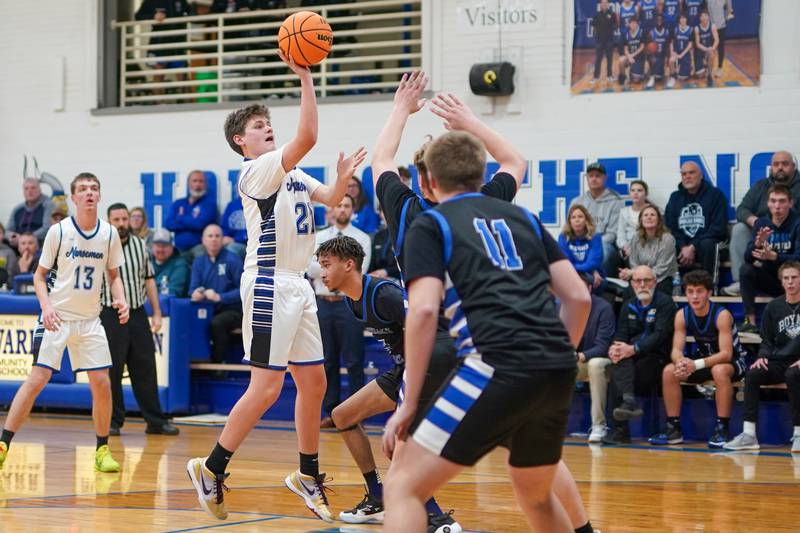 Newark’s Cody Kulbartz (32) shoots a floater in the paint against Hinckley-Big Rock during a basketball game at Newark High School on Tuesday, January 28, 2025.