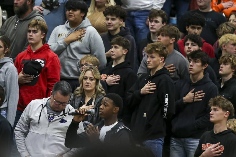 A student sings the National Anthem before basketball game between Sandwich at Plano Tuesday, Dec 9, 2025 in Plano.