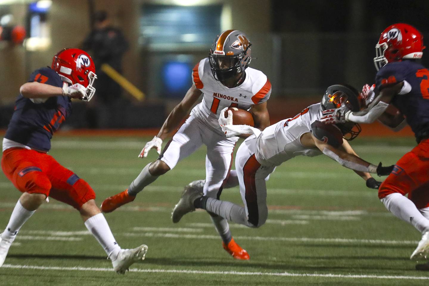 Minooka receiver Malik Armstrong makes a first down catch on Saturday, April 17, 2021, at West Aurora High School in Aurora, Ill.