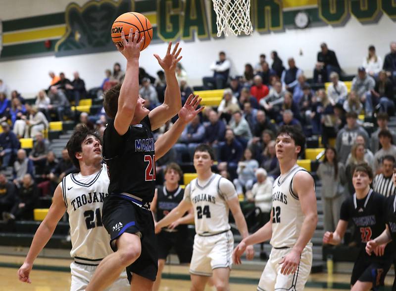 Marmion's Henry Miller drives to the basket against Cary-Grove during an IHSA Class 3A Crystal Lake South Regional boys basketball semifinal game on Wednesday, February, 25, 2026, at Crystal Lake South High School.