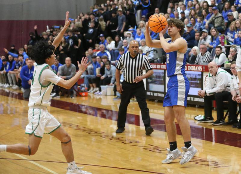 Princeton's Asa Gartin shoots a jump shot over Rock Falls's Nehemiah Menendez during the Class 2A Sectional final on Friday, March 7, 2025 at Marengo High School.