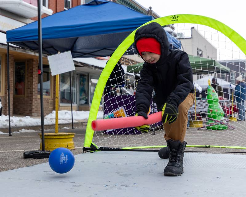 Jofiel Mandujano hits ball with noodle on Saturday, December 6, 2025 on Illinois Avenue in Mendota.
