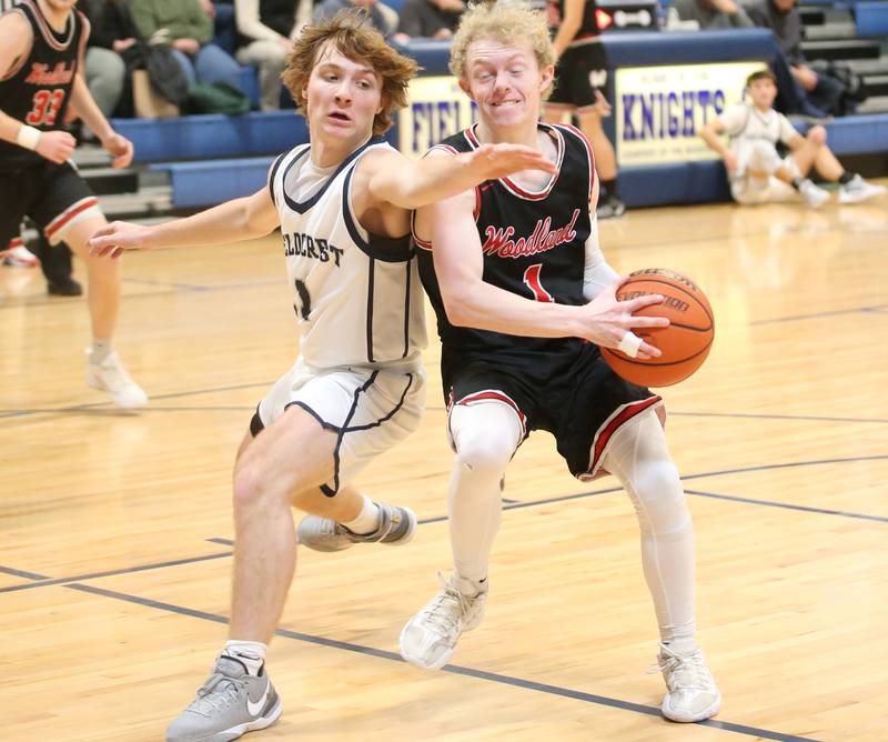 Fieldcrest's Nathan Cook shuts down the lane on Woodland's Connor Dodge on Tuesday, Dec. 19, 2023 at Fieldcrest High School.
