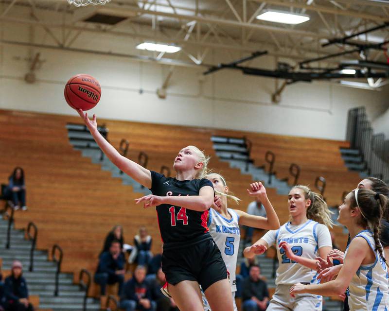 St Charles East's Addie Schilb (14) puts up a shot at the York Thanksgiving Tournament. Nov 13, 2023.