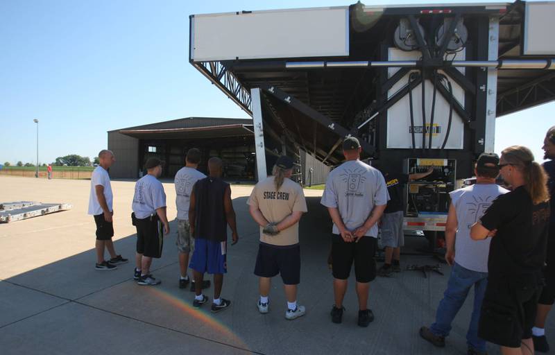 Crews begin to build a Stageline Mobile Stage for the Kid Rock concert on July 12, 2011 at the Illinois Valley Regional Airport in Peru.