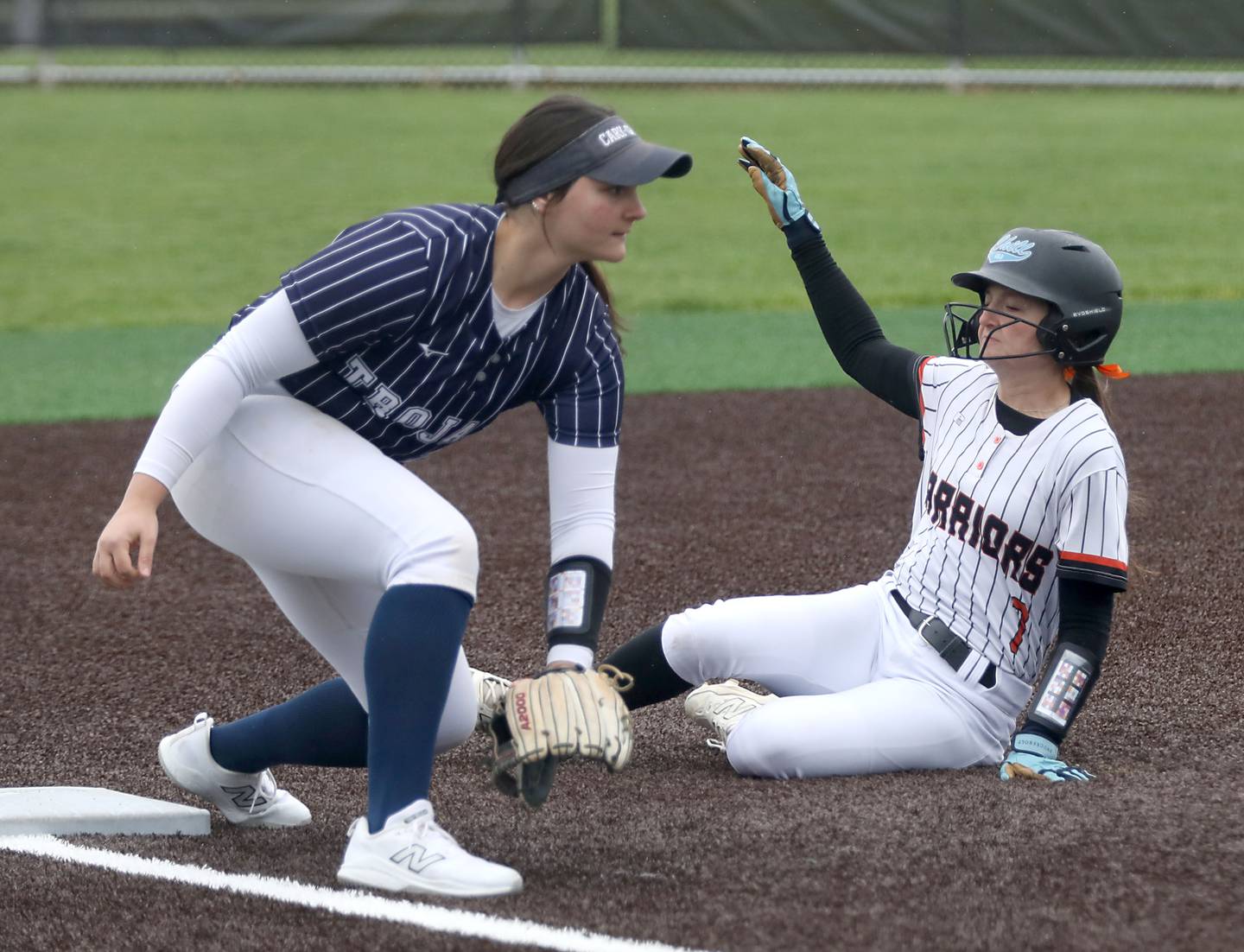 McHenry's Charlee Cape slides into third base and Cary-Grove's Addison DeSomer waits for the throw during a Fox Valley Conference softball game on Thursday, April 30, 2026, at McHenry High School.