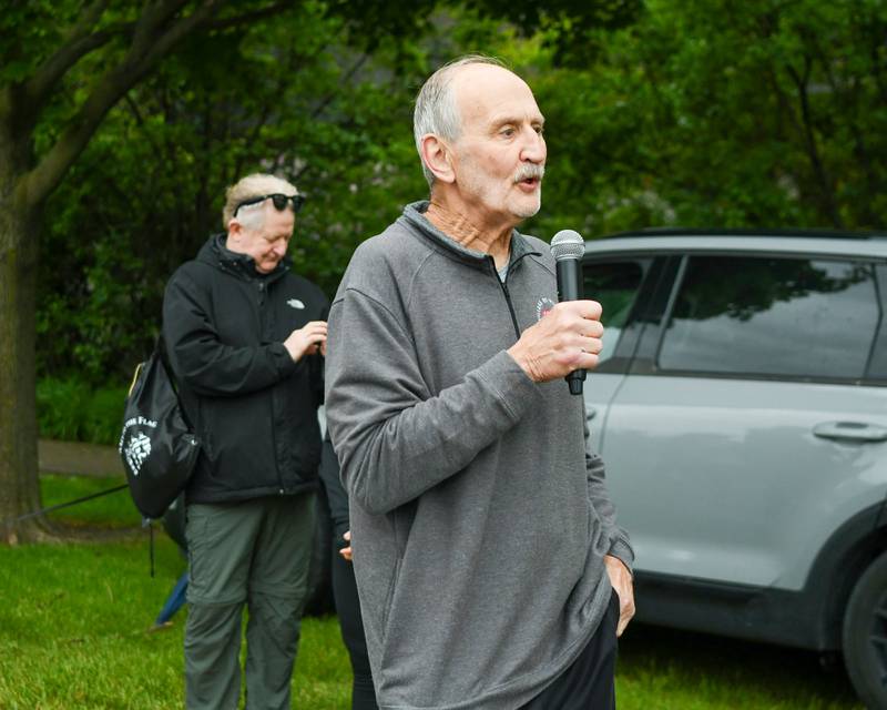 Retired Westmont Mayor Ron Gunter speaks before the start of the Race To The Flag 5k on Sunday May 25, 2025, held at Ty Warner Park in Westmont.
