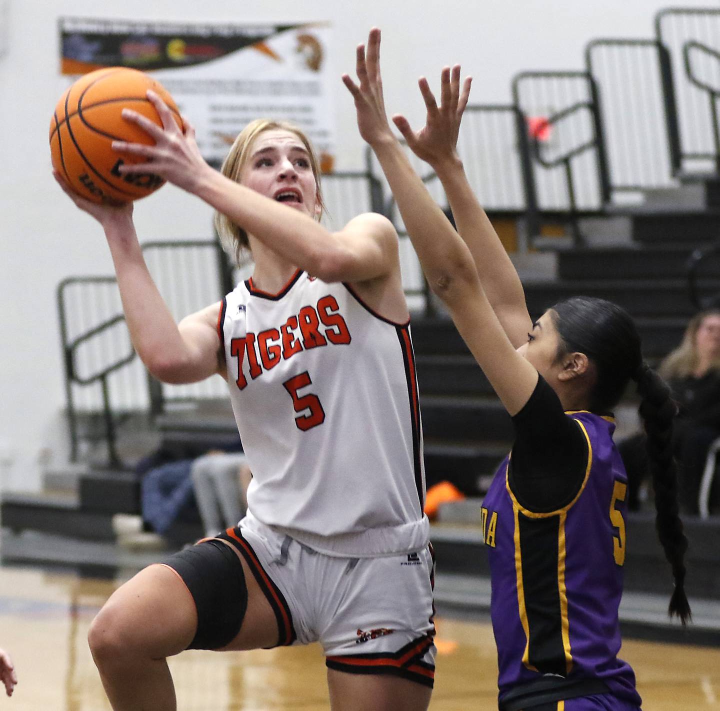 Crystal Lake Central's Ruby Macke shoots the ball over Wauconda's Alessandra Rodriguez during the Northern Illinois Holiday Classic Championship game on Thursday, Dec. 19, 2024, at McHenry High School.