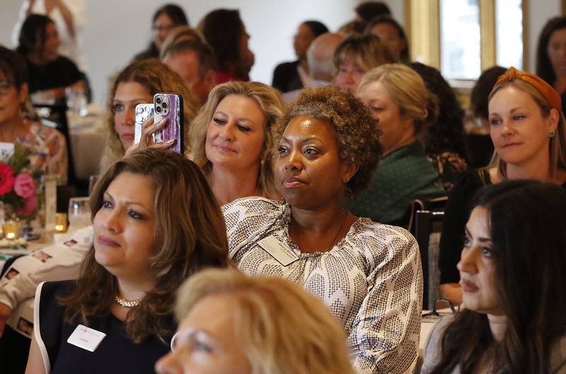 People listen as award recipient Donna Rasmusse speaks during the Northwest Herald's Women of Distinction award luncheon Wednesday June 4, 2025, at Boulder Ridge Country Club, in Lake in the Hills. The luncheon recognized ten women in the community as Women of Distinction.