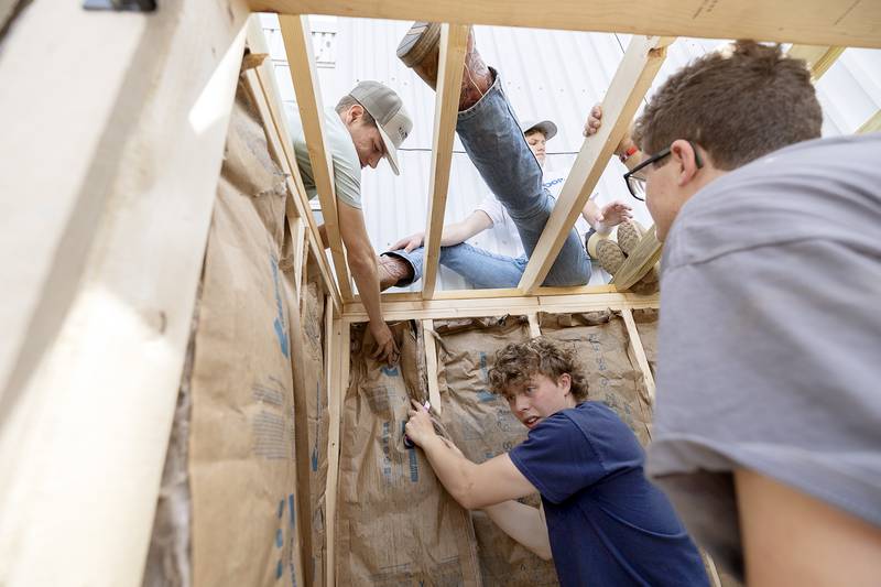 Ag Construction members install insulation in the food center Friday, May 16, 2025.